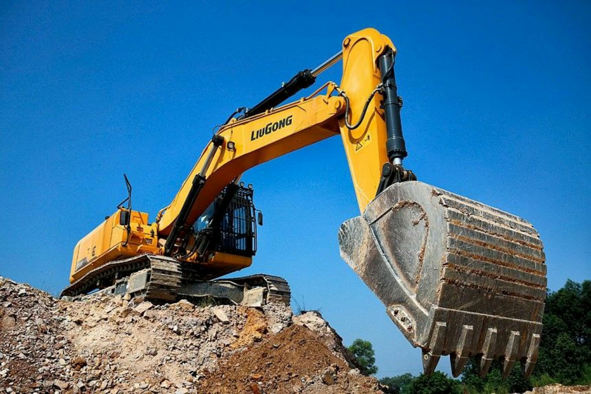 Construction excavator against a blue sky